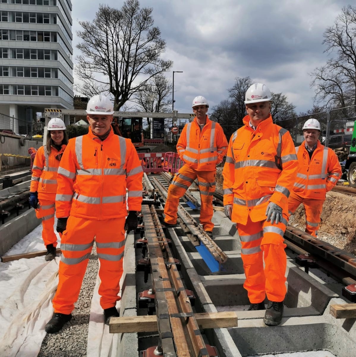 Clockwise from front left, Peter Cushing, Director of the Midland Metro Alliance, Marta Gasch, Lead Track Engineer, Martin Ponter, Delivery Manager, Stephen Christopher, Deputy Construction Director and Iain Anderson, Managing Director of Colas Rail Urban & Industries, mark the final weld milestone